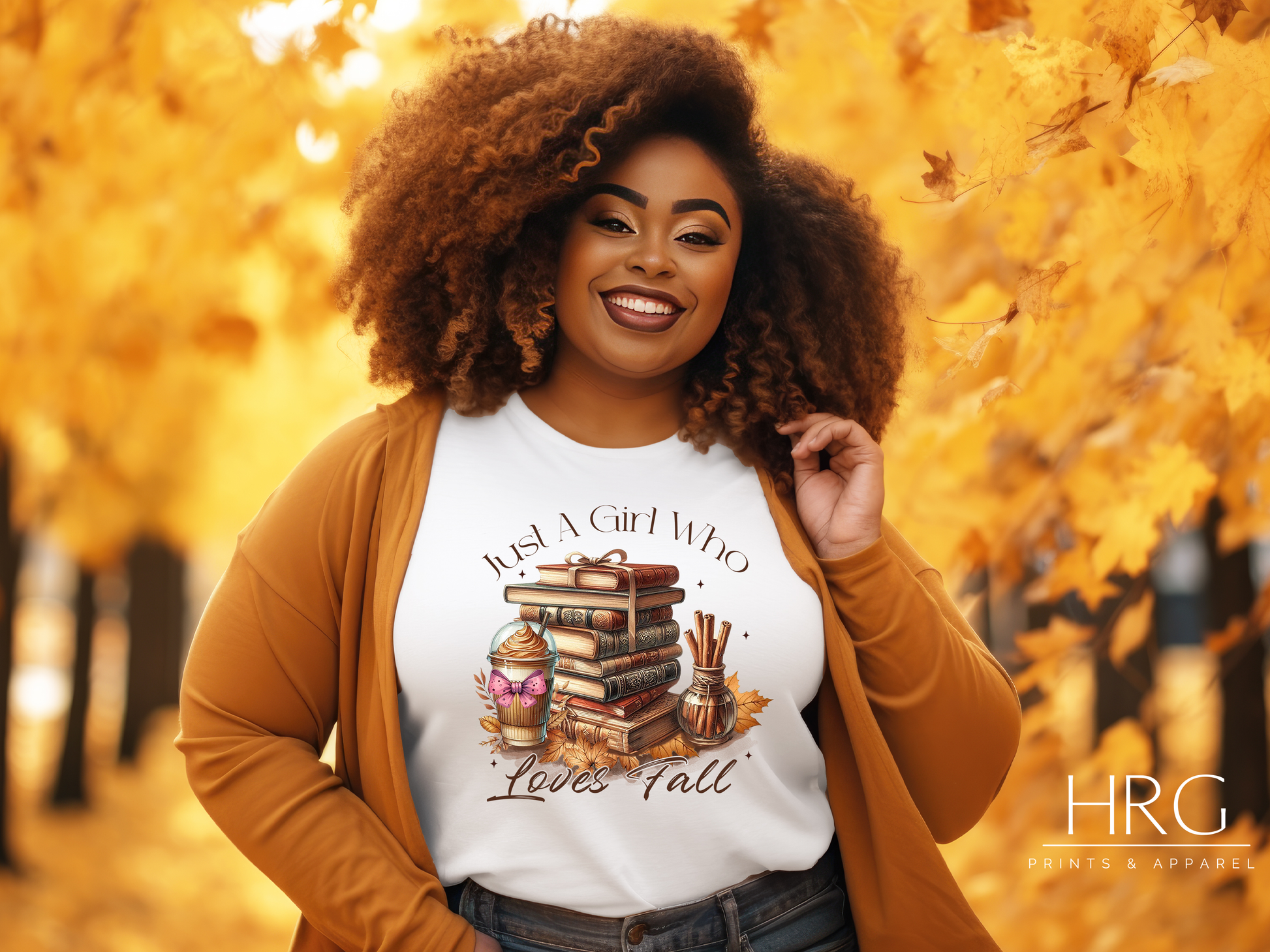 Fall-themed t-shirt design featuring the words 'Just a girl who loves fall' in elegant script. The design includes a cozy stack of books, autumn leaves, cinnamon sticks, and a pumpkin spice latte, capturing the warm and inviting essence of the season.
